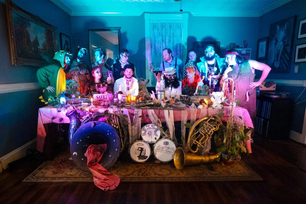 a group of colorful people around a table